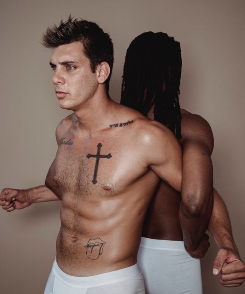 Man performing a dynamic strength exercise in a minimalist gym.