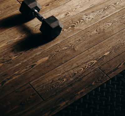 Minimalist workout equipment arranged neatly on the floor.